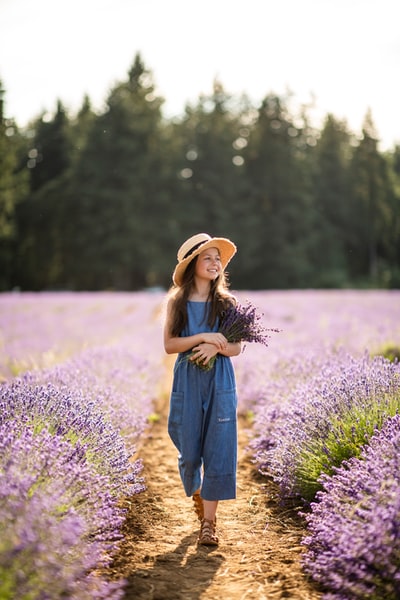 The woman standing in the lavender ribbon
